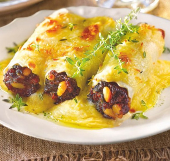 Canelones de morcilla, espinacas y piñones