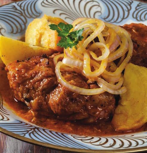 Chancho a la Naranja Agria con ajos y cebolla al estilo criollo